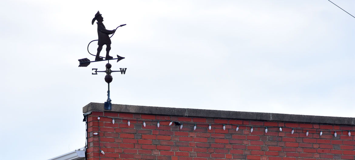 Firefighter weathervane atop Beverly Farms fire station, Beverly, Massachusetts, March 6, 2022. (©Greg Cook photo)