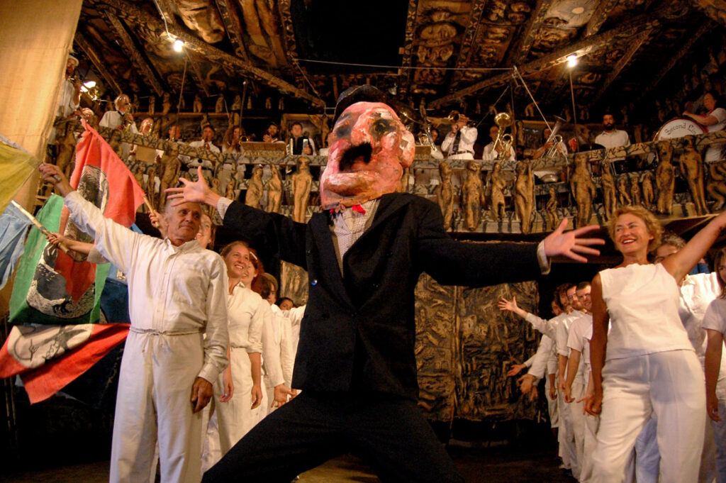 Genevieve Yeuillaz (right) performs in Bread and Puppet Circus, Glover, Vermont, Aug. 22, 2010. (©Greg Cook photo)