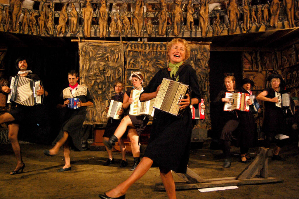 Genevieve Yeuillaz (center) performs in Bread and Puppet Circus, Glover, Vermont, Aug. 22, 2010. (©Greg Cook photo)
