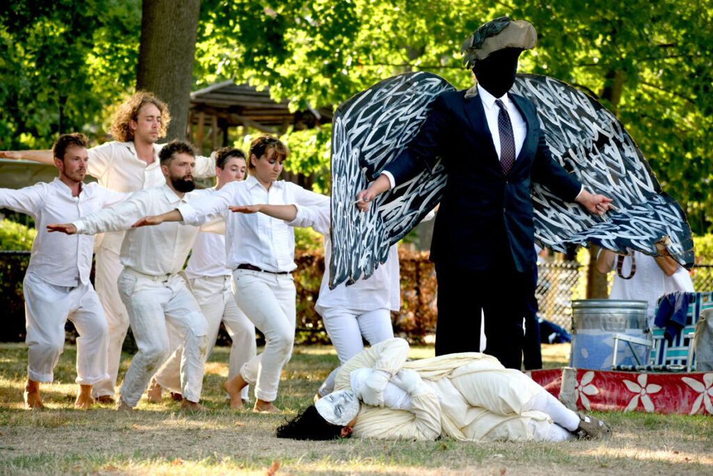 Bread and Puppet Theater performs an act mourning the Russian invasian of Ukraine. From its “Apocalypse Defiance Circus” on Cambridge Common, Sept. 4, 2022. (© Greg Cook photo)