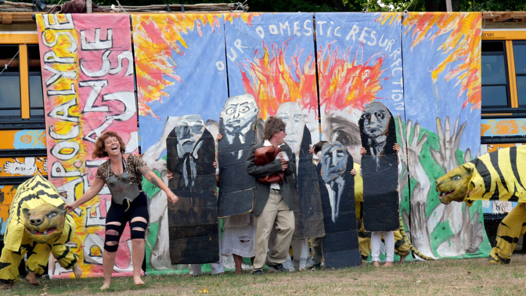 Bread and Puppet Theater performs an act objecting to the radically right-wing U.S. Supreme Court. From its “Apocalypse Defiance Circus” on Cambridge Common, Sept. 4, 2022. (© Greg Cook photo)