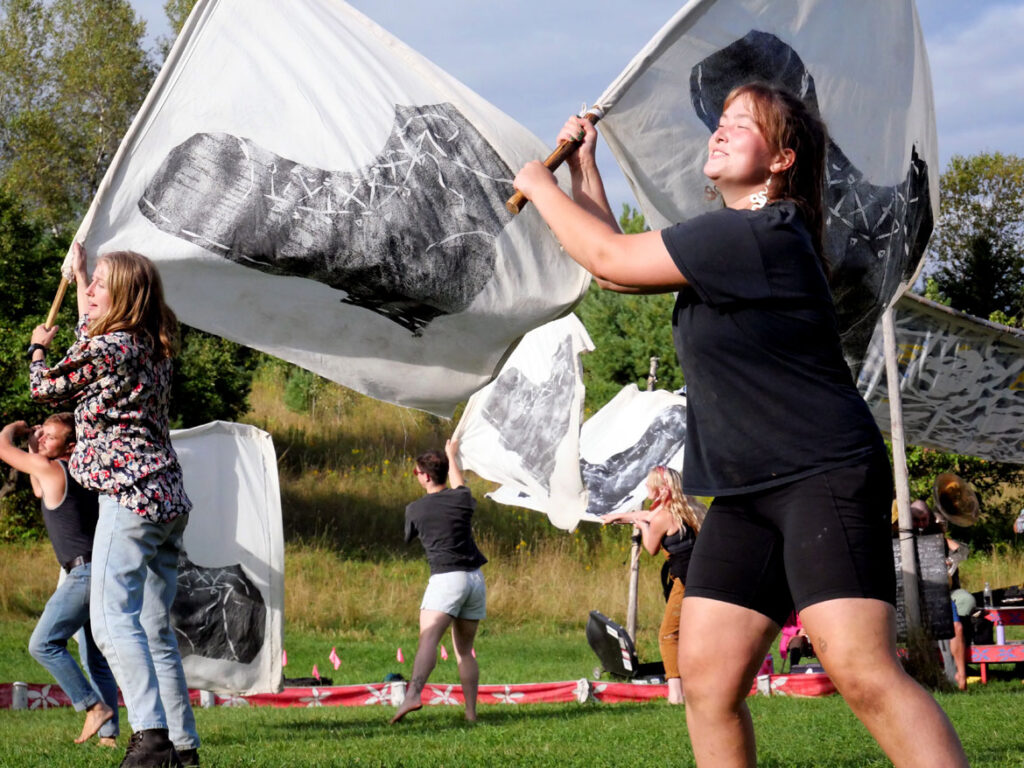 Bread and Puppet Theater rehearses an act supporting reproductive rights that was later cut from its "Apocalypse Defiance Circus" in Glover, Vermont, Aug. 27, 2022. (© Greg Cook photo)