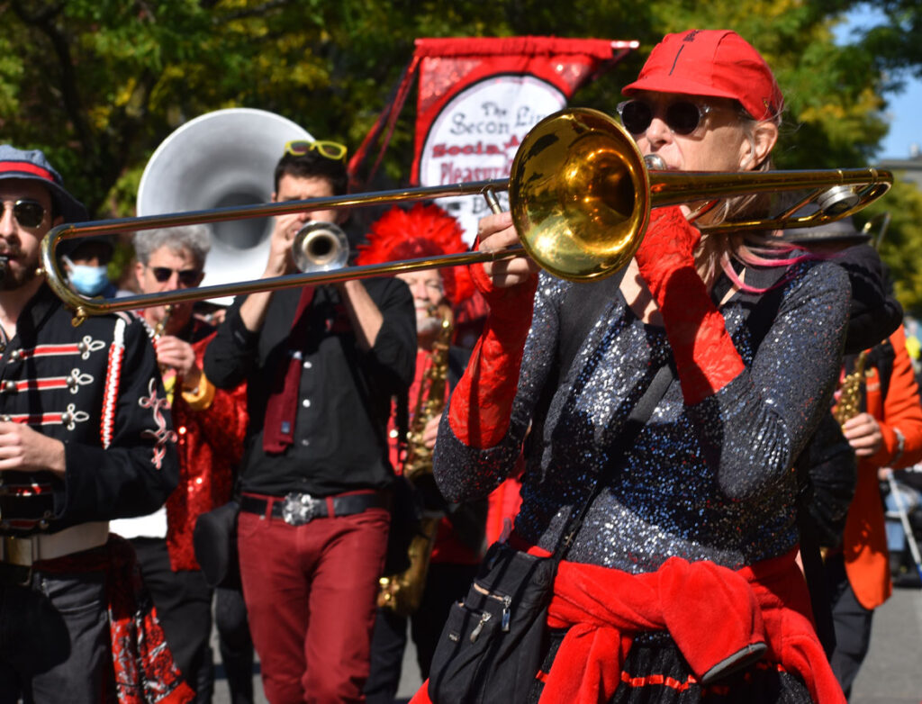 The Second Line Social Aid and Pleasure Society Brass Band from Somerville and Cambridge performs in the Honk parade from Somerville's Davis Square to Cambridge's Harvard Square, Sunday, Oct 9, 2022 (©Greg Cook photo)