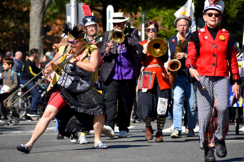 Leftist Marching Band from Portsmouth, New Hampshire, performs in the Honk parade from Somerville's Davis Square to Cambridge's Harvard Square, Sunday, Oct 9, 2022 (©Greg Cook photo)