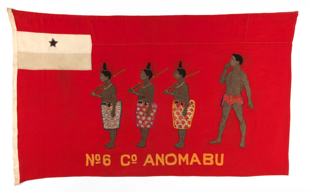 John Freeman Acquah, Anomabo workshop, Kyirem No. 6 Company Anomabo, before 1928; cotton, synthetic fabric, silk (?). On certain flags the company celebrated the valor or skill of its women as a way to underscore the even greater ability of its men. A procession of women with guns follows the orders of a man on this flag, illustrating the saying, “If our women are strong, what will our men do?” The implication is that the women of this company are strong enough to overtake the men of other companies.