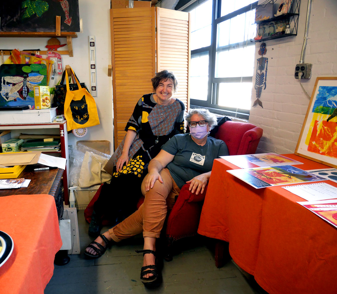 Cecily Miller (left) in her studio with Susan Berstler at Vernon Street Studios during Somerville Open Studios, May 6, 2023. (©Greg Cook photo)