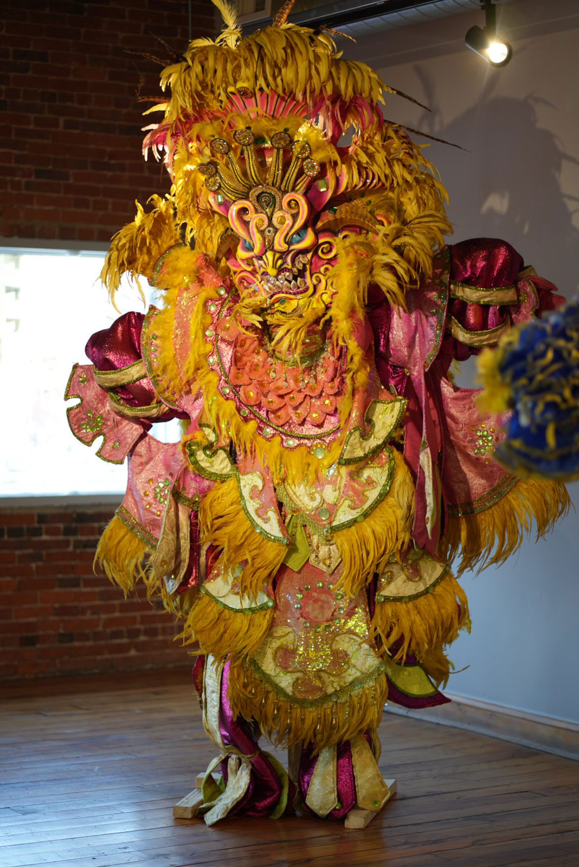 Asociacion Carnavalesca de Massachusetts mask and suit in “El Carnaval Continúa" at the Essex Art Center, Lawrence. (Mariana Martins photo)