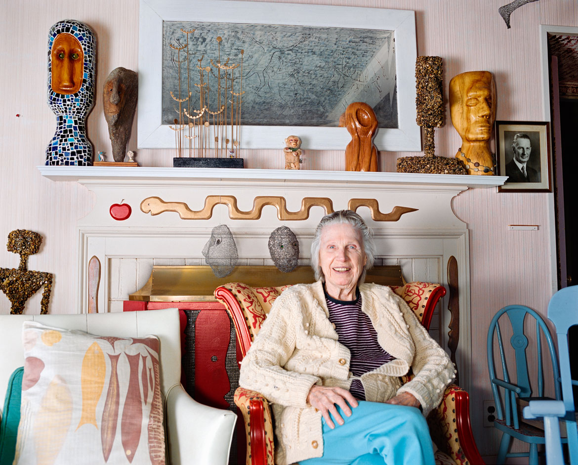 Ted Degener (American, b. 1948). Mary Nohl sits in the living room of her home environment in Fox Point, Wisconsin, 1998. Archival pigment print. Photo courtesy Ted Degener