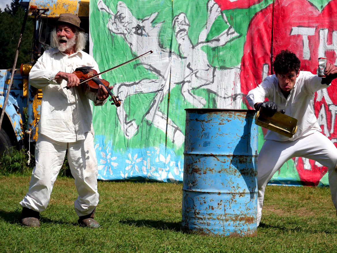 Peter Schumann (left) performs in Bread and Puppet Theater's "The Heart of the Matter" Circus, Glover, Vermont, Sunday, July 30, 2023. (©Greg Cook photo)