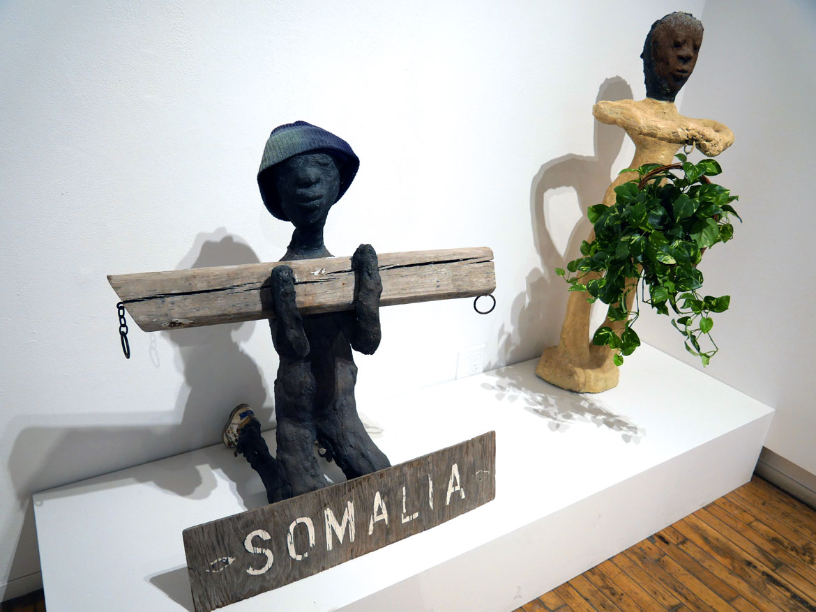 Dr. Charles Smith, “Somalia” (left) and “Memorial to Velma Smith, Michael, Velma’s Son,” concert, mixed media and paint. In “Ted Degener: At Home with Artists” at Intuit in Chicago.