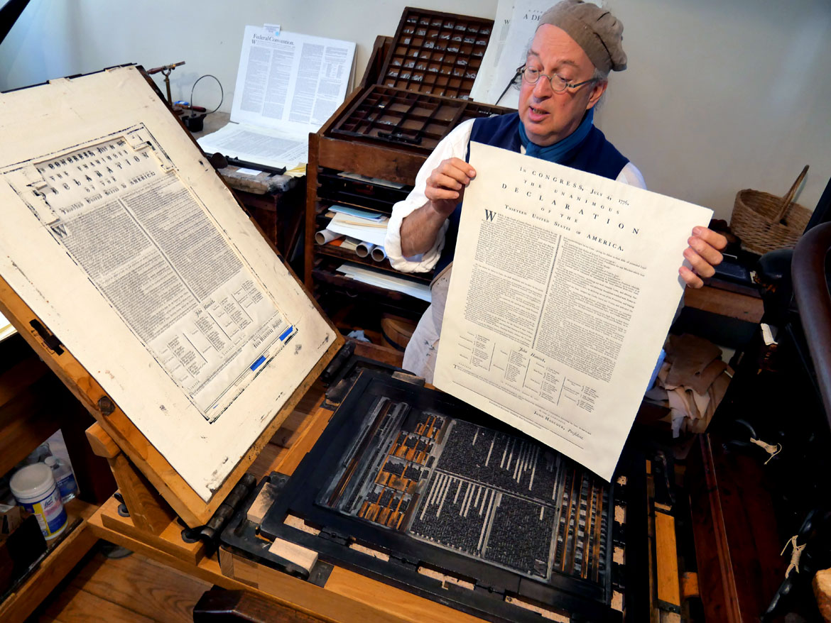 Gary Gregory of the Printing Office of Edes & Gill, in the 1715 Clough House o the campus of Boston's Old North Church, Aug. 13, 2023. (©Greg Cook photo)