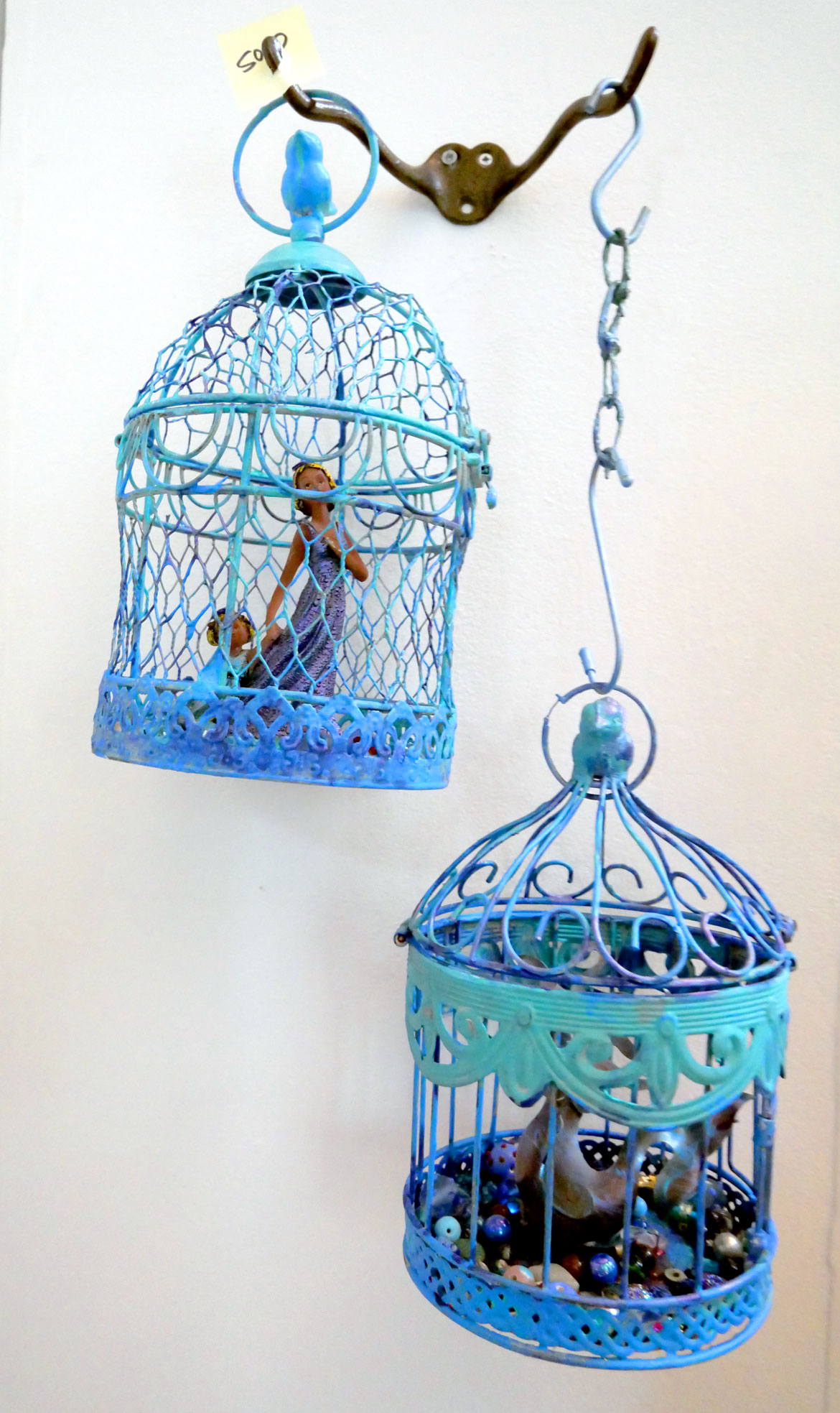 Ruth Faris, "2 Blue Cages," 2023, painted cages with beaded interior.