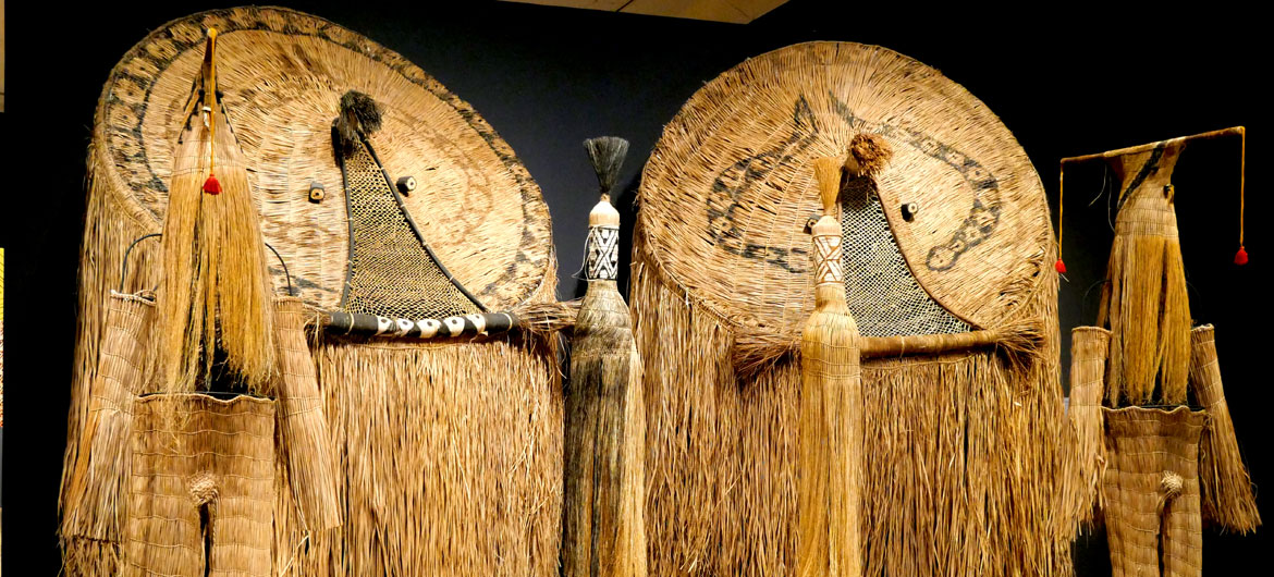 Itsautaku Waurá, Karapotan Waurá, and Aulahu Waurá, "Atujuwá Masks and Skirts," "Supukuyawa Yuluma Eneju Mask and Outfit," "Spukuyawa Yuluma Toneju Mask and Outfit," and "Pair of Yukuku Masks," 2000, buriti fiber, vine, wool thread, beeswax adhesive putty, metal, wood, annatto and genipap.