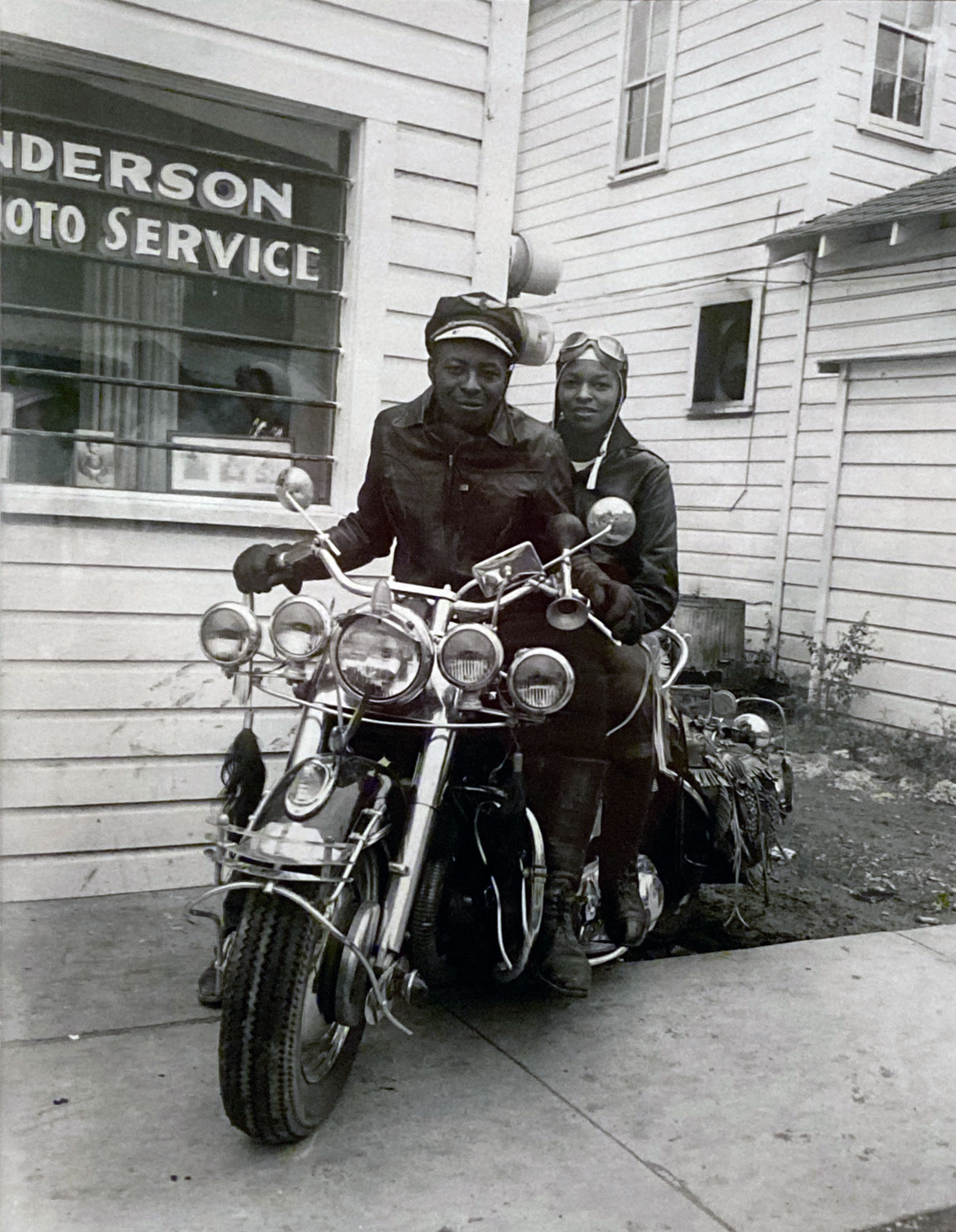Henry Clay Anderson, "Portrait of a couple on a motorcycle outside of Anderson Photo Service Studio," about 1960.