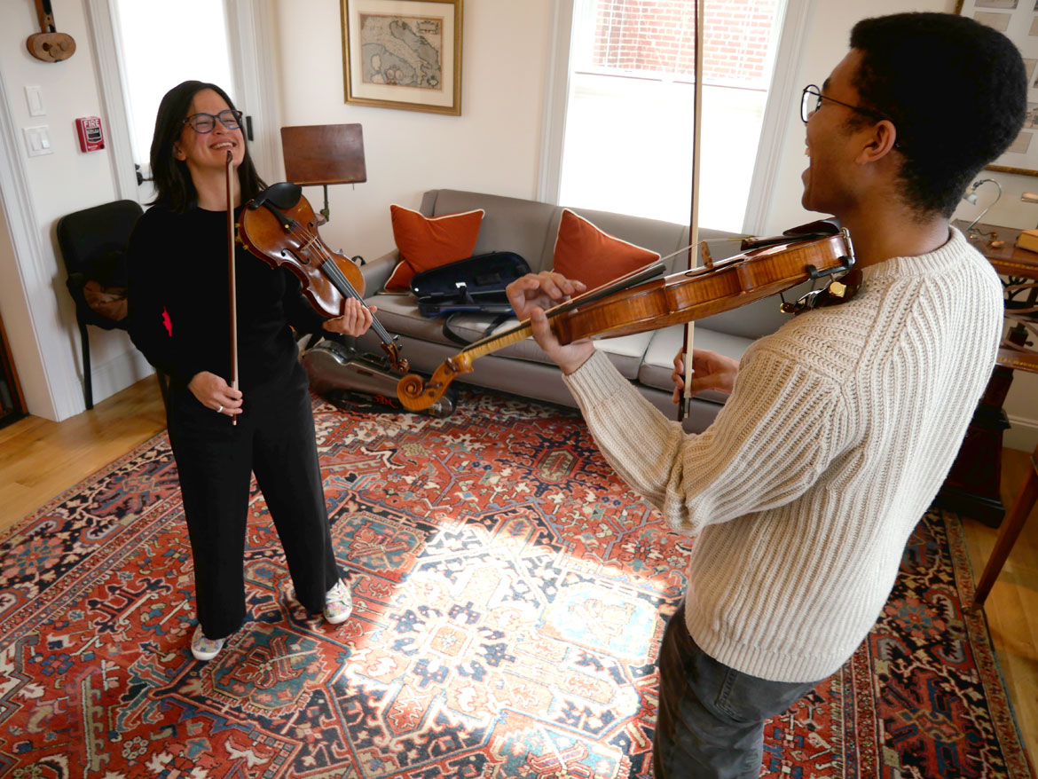 Megumi Stohs Lewis (left) and Grant Houston of A Far Cry at Reuning & Son Violins, Brookline, March 25, 2024. (©Greg Cook photo)