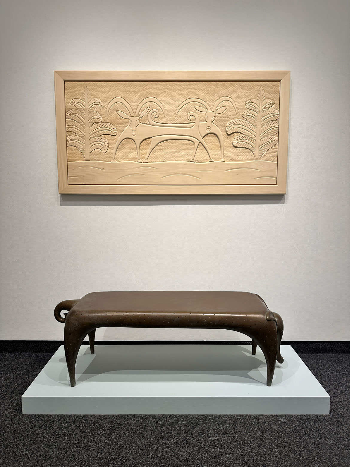 Judy Kensley McKie, "Gazelle Headboard," 2013, carved basswood (above) and "Timid Dog Table," 2004, cast bronze. (Gallery NAGA)