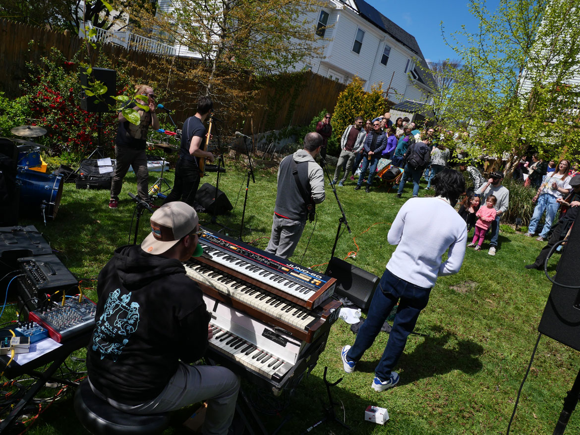 The Van Burns performed in a yard behind Vernon Street during the 2024 Somerville Porchfest, May 11, 2024. (©Greg Cook photo)