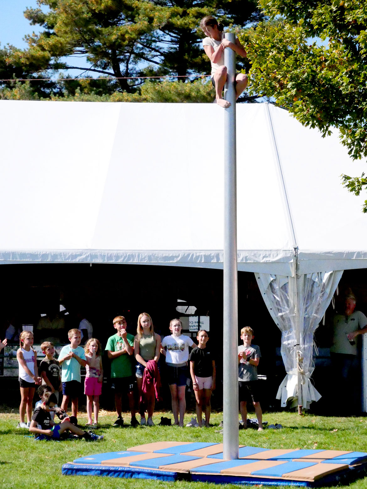 Climbing the Money Pole. Topsfield Fair, Oct. 6, 2025. (©Greg Cook photo)