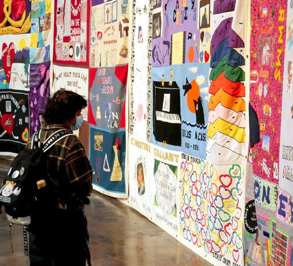 Names AIDS Memorial Quilt at the 34th Annual World AIDS Day Vigil at the Boston Center for the Arts, Nov. 30, 2025. (©Greg Cook photo)
