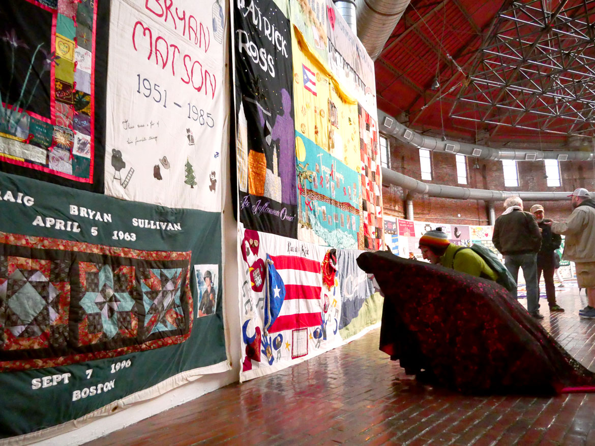 Names AIDS Memorial Quilt at the 34th Annual World AIDS Day Vigil at the Boston Center for the Arts, Nov. 30, 2025. (©Greg Cook photo)