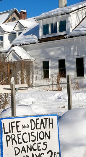 Sign advertising winter performances of "Life and Death Precision Dances" at Bread and Puppet Theater, Glover, Vermont, Feb. 9, 2026. (©Greg Cook photo)