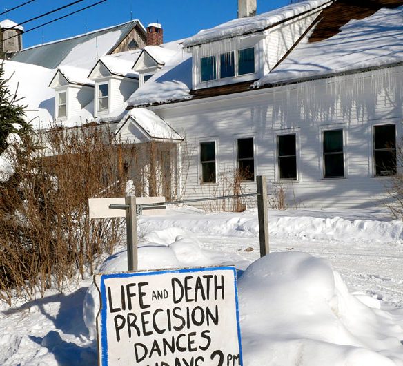 Sign advertising winter performances of "Life and Death Precision Dances" at Bread and Puppet Theater, Glover, Vermont, Feb. 9, 2026. (©Greg Cook photo)