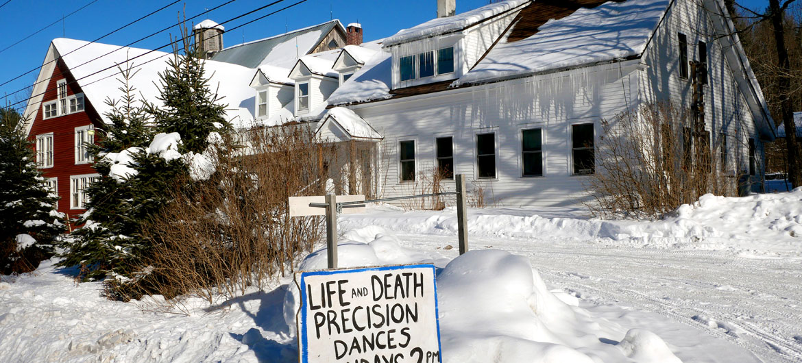 Sign advertising winter performances of "Life and Death Precision Dances" at Bread and Puppet Theater, Glover, Vermont, Feb. 9, 2026. (©Greg Cook photo)