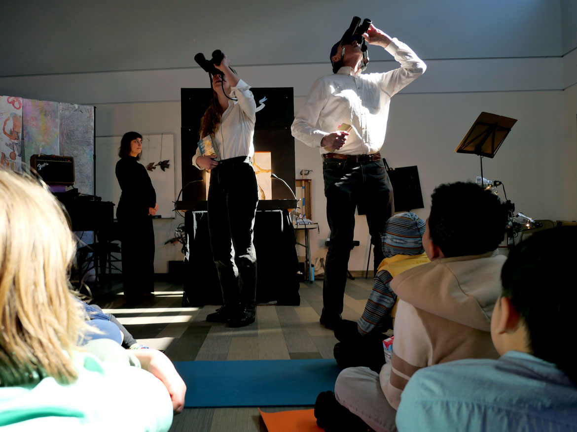 Ziggy Bird-Roberts (left) and John Bell perform "Homecoming" at Mystic Activity Center, Somerville, March 21, 2026. (©Greg Cook photo)