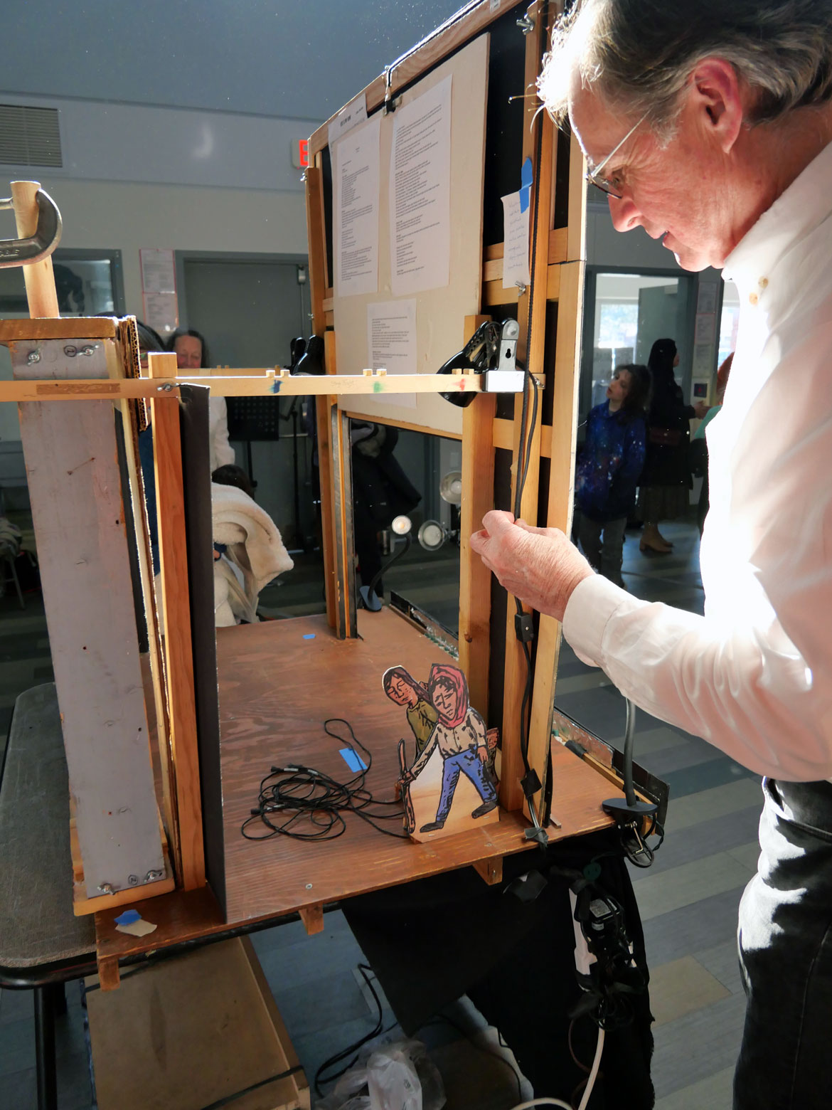 John Bell behind the scenes of "Homecoming" at Mystic Activity Center, Somerville, March 21, 2026. (©Greg Cook photo)