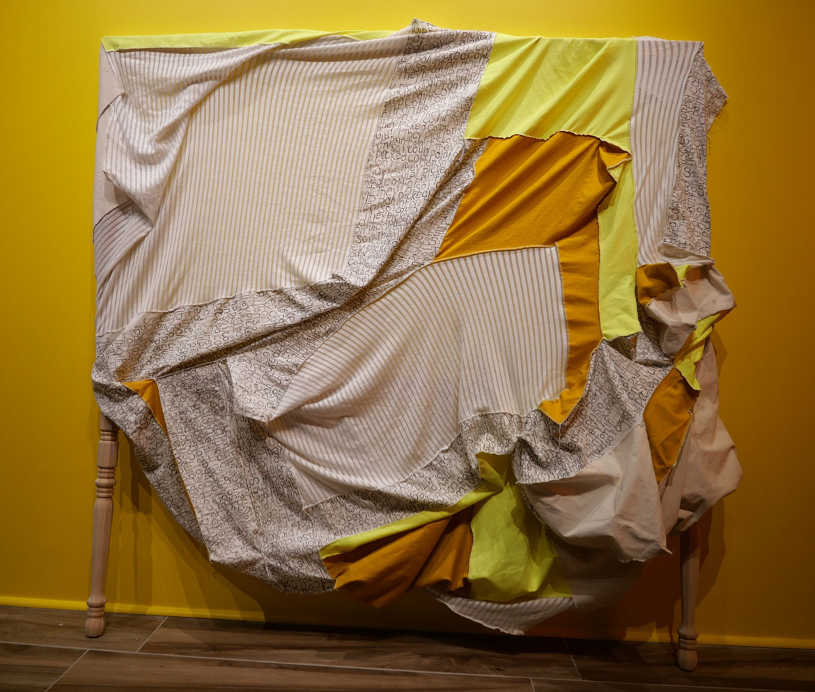 Destiny Palmer, "The Burden Moving Forward," handwritten fabric and fabric remnants on wooden frame.