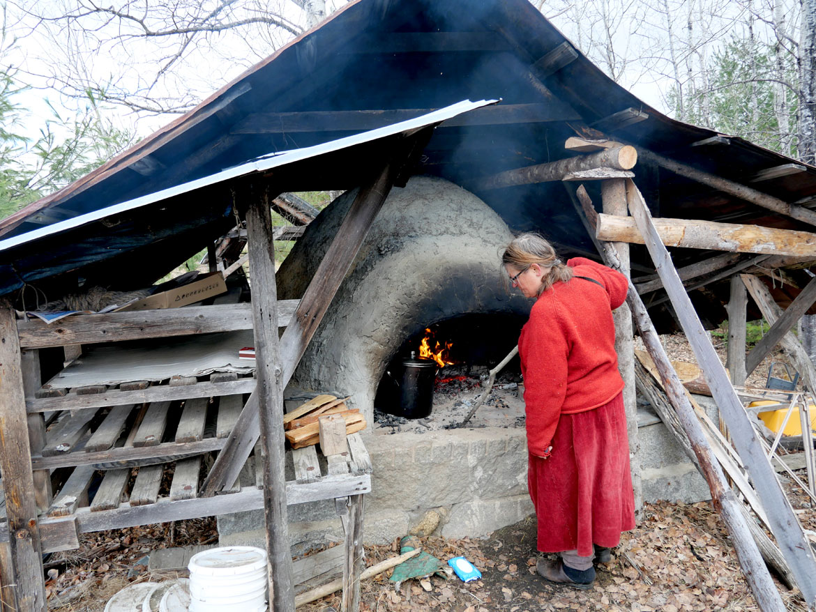 Maria Schumann prepares for the "Spring Ritual" at Bread and Puppet Theater, Glover, Vermont, April 11, 2026. (©Greg Cook photo)