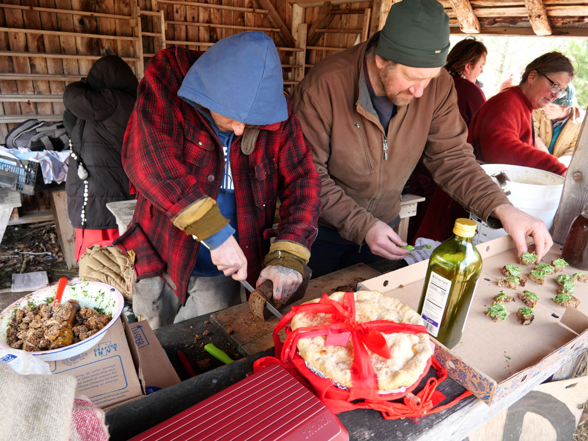 Serving bread and crepes at the Bread House after the "Spring Ritual" at Bread and Puppet Theater, Glover, Vermont, April 11, 2026. (©Greg Cook photo)