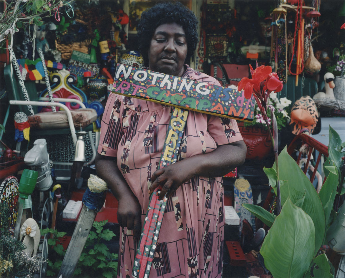 Mrs. L.V. Hull, MS, #3. L.V. Hull surrounded by her art environment and garden in Kosciusko, Mississippi in 2000. (Photo: Bruce West. Collection of the Mississippi Museum of Art)