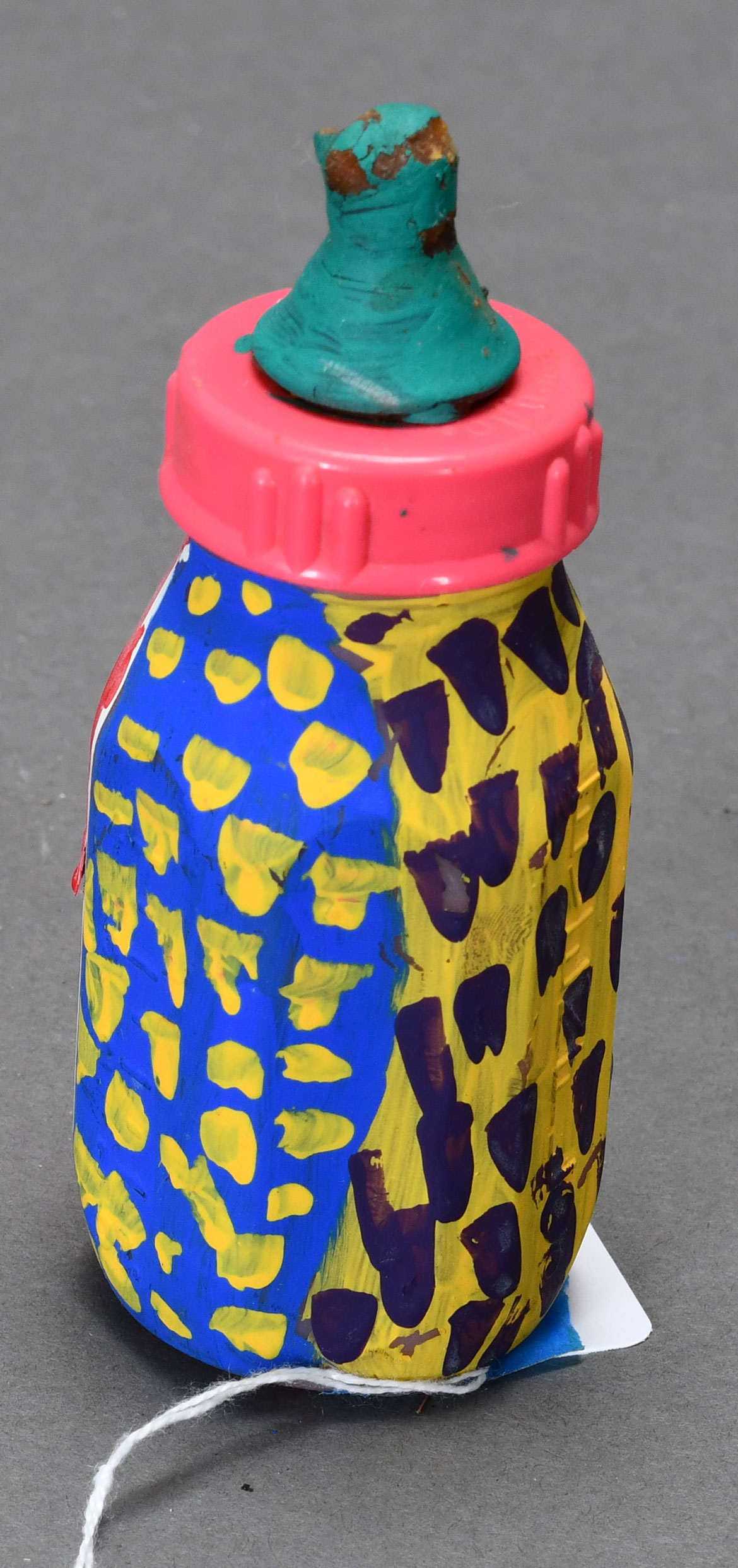 L.V. Hull, Untitled, n.d. Acrylic paint on plastic bottle, 5.5 x 2 x 2 inches. Courtesy of the Estate of L.V. Hull, Arts Foundation of Kosciusko. Gift of Kohler Foundation, Inc.