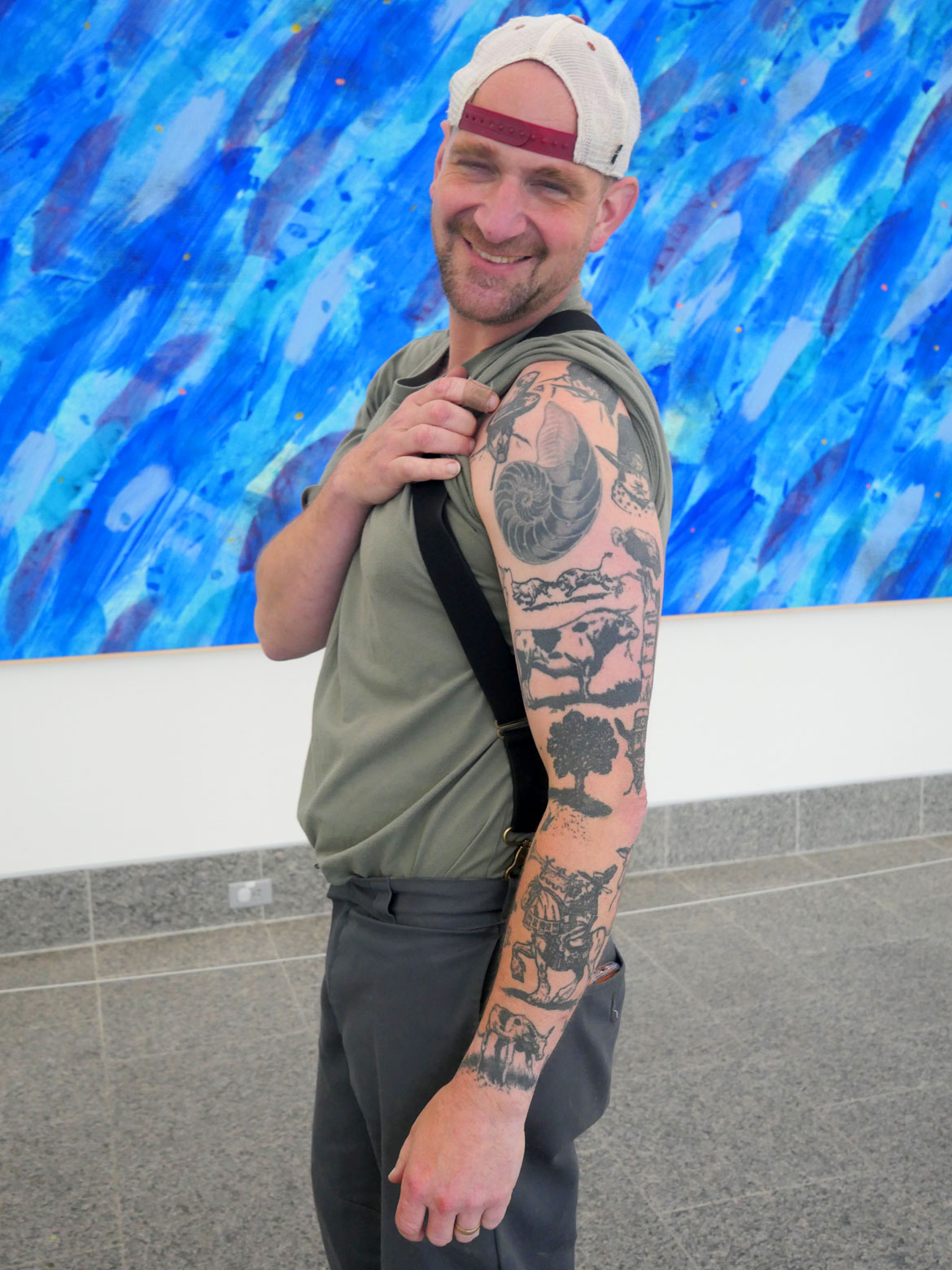 Ryan Williams's arm is tattooed with illustrations from "The Story of Ferdinand." (©Greg Cook photo)