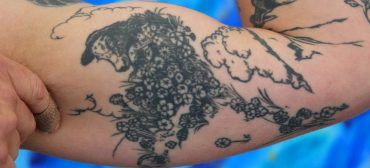 Ryan Williams's arm is tattooed with illustrations from "The Story of Ferdinand." (©Greg Cook photo)