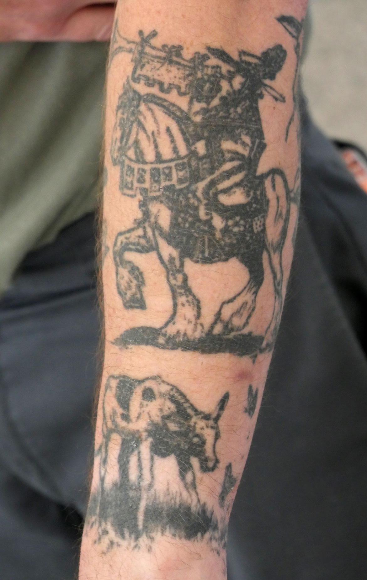 Ryan Williams's arm is tattooed with illustrations from "The Story of Ferdinand." (©Greg Cook photo)