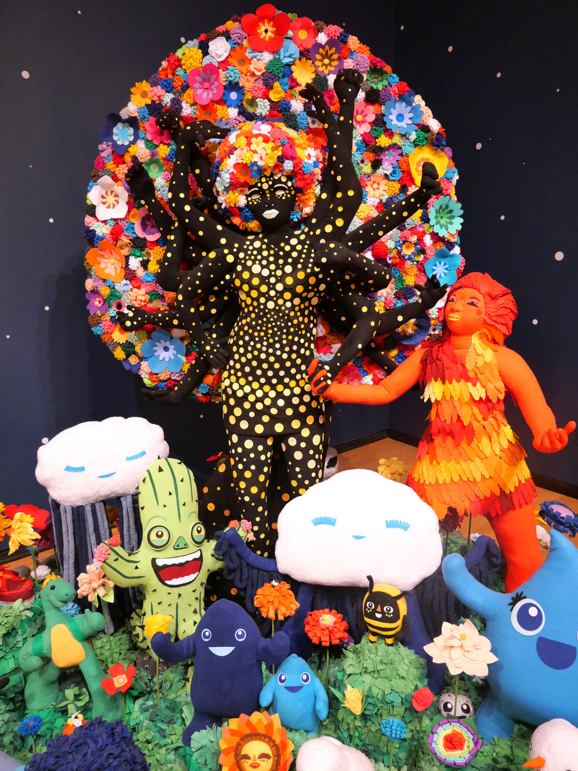 JooYoung Choi. Detail of "Resilient Heart and the Tree of Miracles; Children Need Love Like Flowers Need Rain: Quantum Soup Surfer Arrangement," 2018-2025. Wooden armature, quilt poly-fiber batting, fleece, poly-fill, metal hardware, screws, poly-foam, felt.