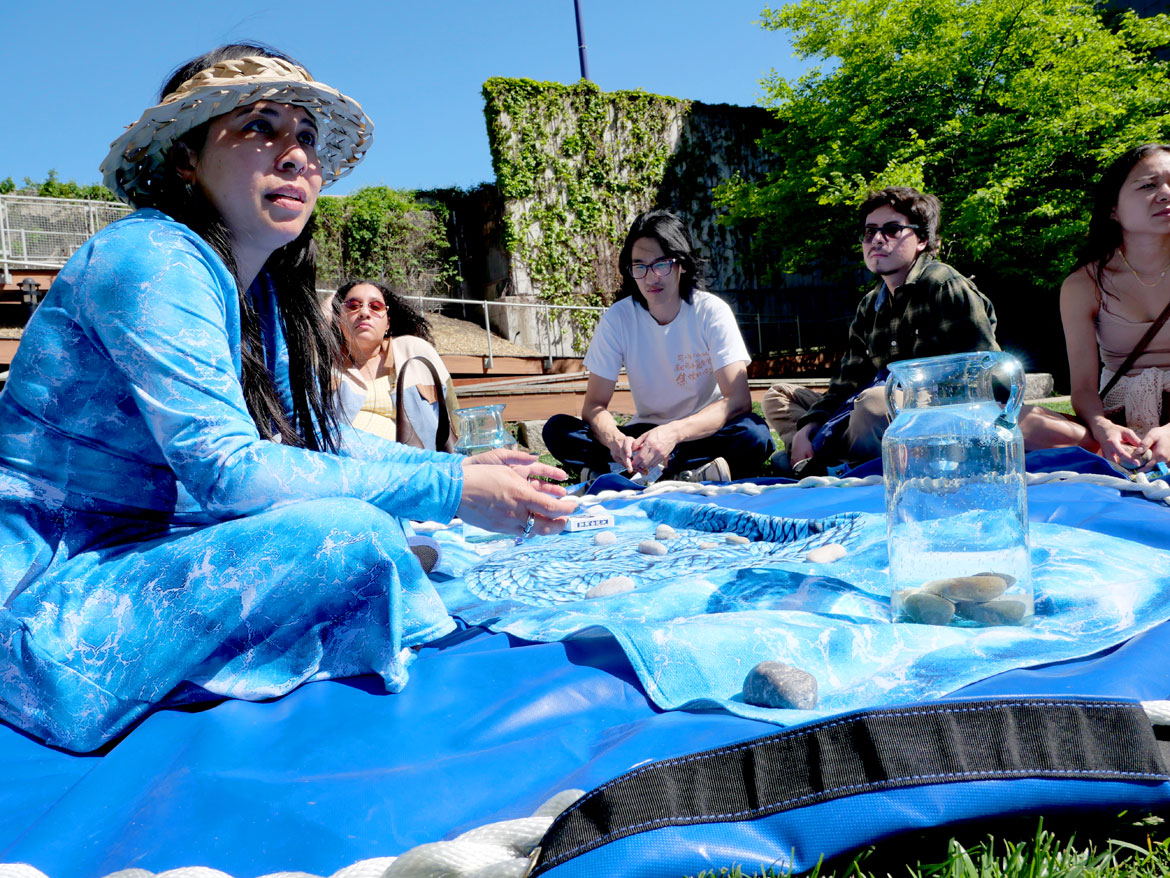 Lani Asunción presents "Hilom Community Circle: Between Water & White Flowers" at One Greenway Park on Hudson Street, Chinatown, Boston, May 16, 2026. (©Greg Cook photo)