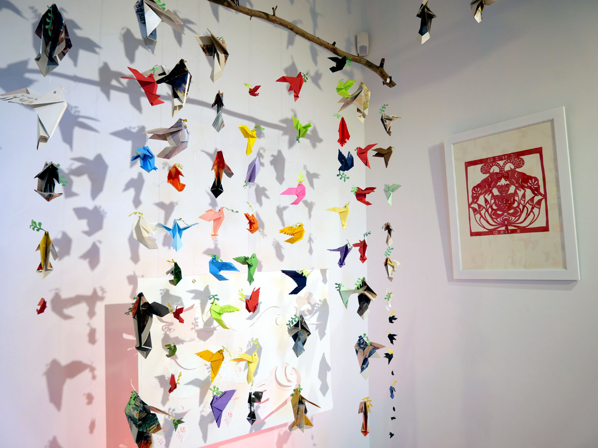 Zhonghe (Elena) Li, "Returning To The Shore--Peace And Compassion," 2026, including "Ancestral Dreams Of Peace," paper, wood stick, plastic wire (left), and "Letting Go, Returning To The Shore," Chinese red rice paper, gold leaf.