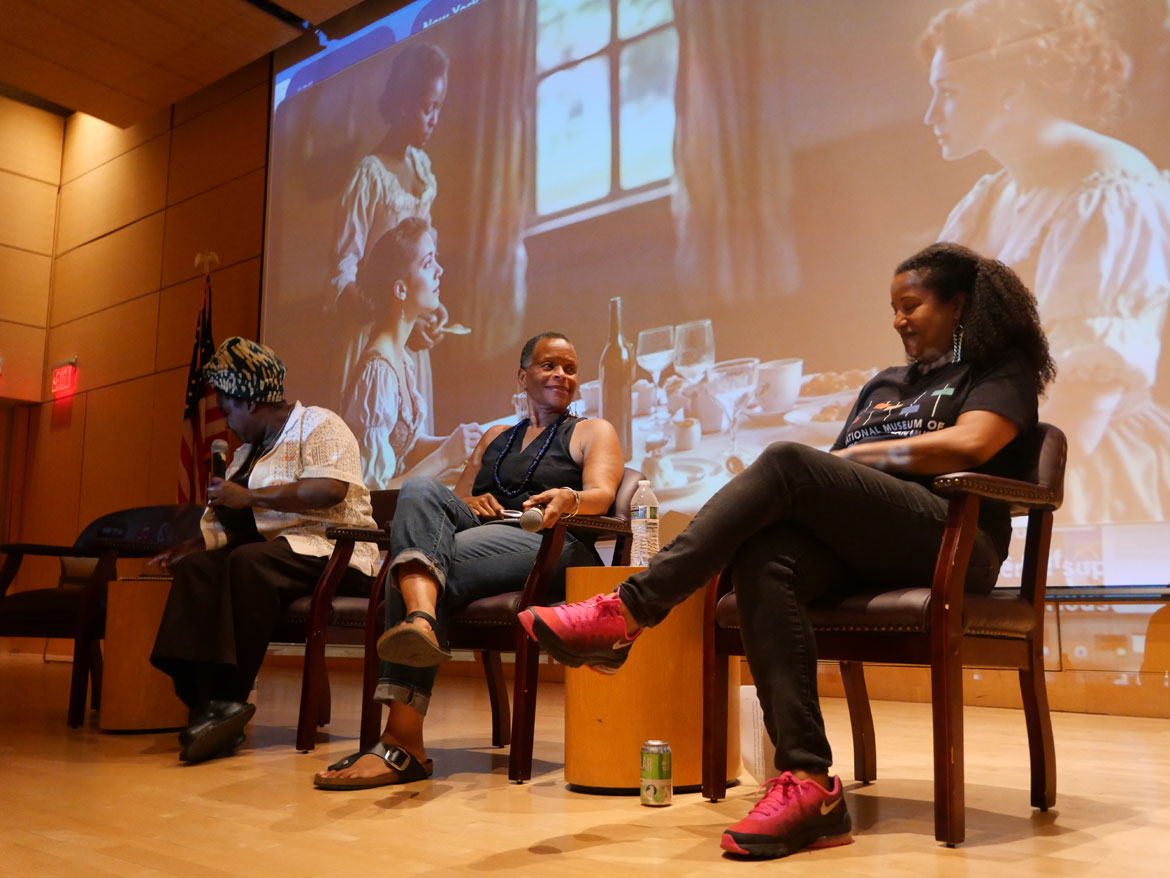 Royall House and Slave Quarters Executive Director Kyera Singleton (from left) and artists Ife Franklin and Dell Marie Hamilton speak at “Land/Mark: Enslavement, Resistance and Revolution" at the Cambridge Public Library, June 13, 2026. (©Greg Cook photo)