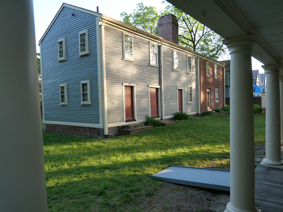 Royall House Slave Quarters in Medford, Massachusetts as seen from the house porch, June 3, 2026. (©Greg Cook photo)