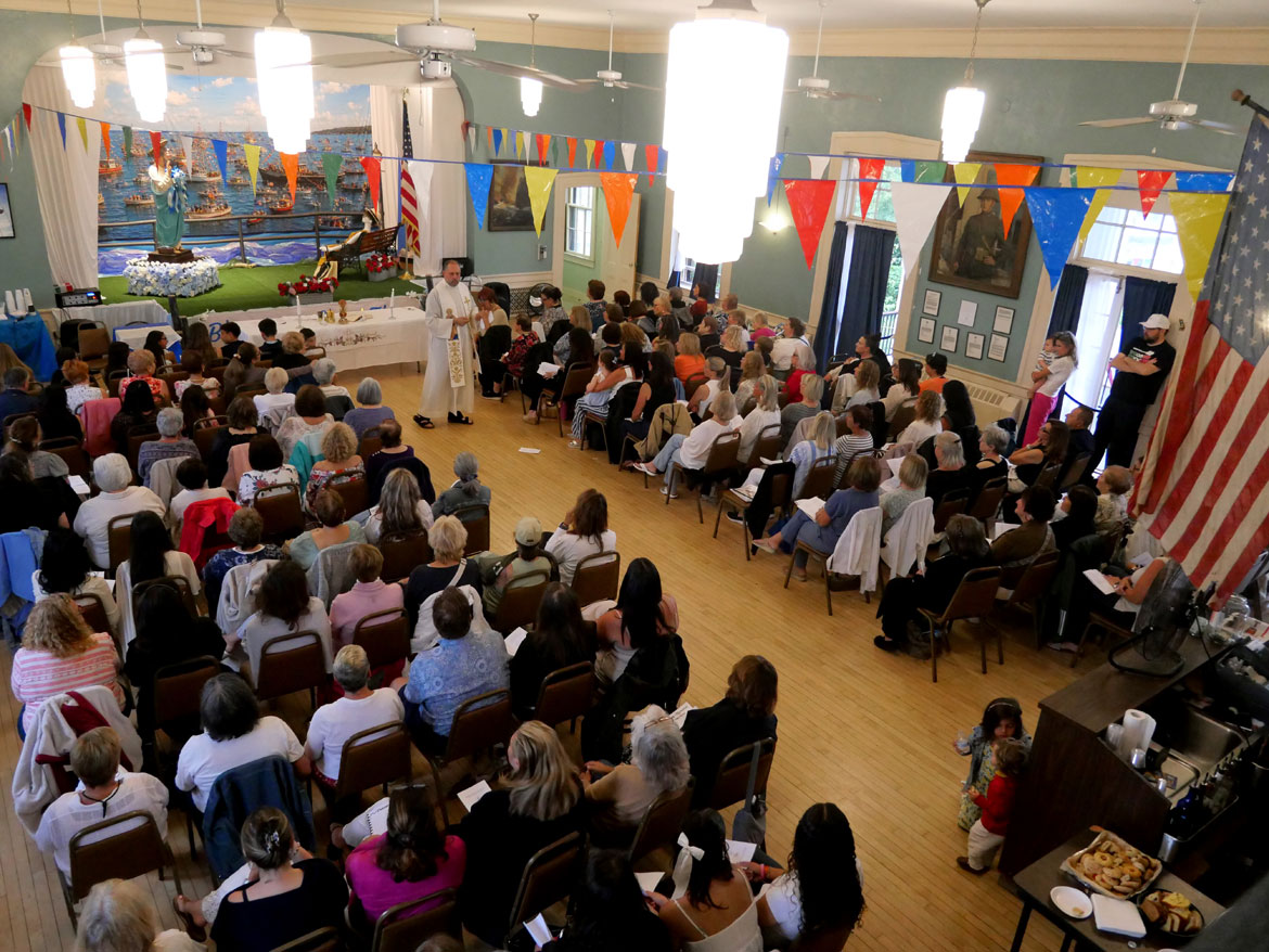 Father James Achadinha leads the Mass that concludes the Novena at the American Legion Hall in advance of St. Peter's Fiesta, Gloucester, June 23, 2026. (©Greg Cook photo)