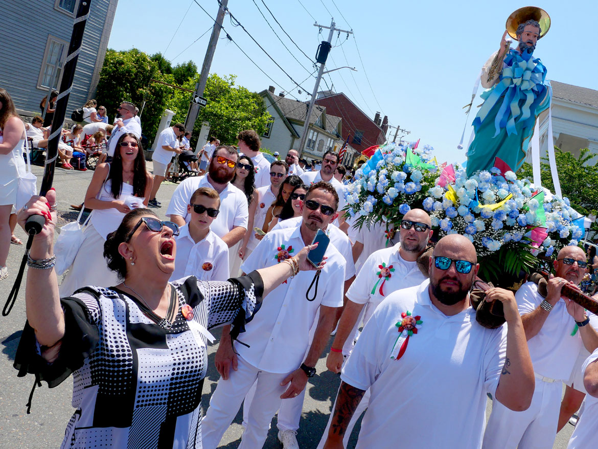 Sefatia Romeo Theken shouts blessings during St. Peter’s Fiesta Sunday Procession, Gloucester, June 28, 2026. (©Greg Cook photo)