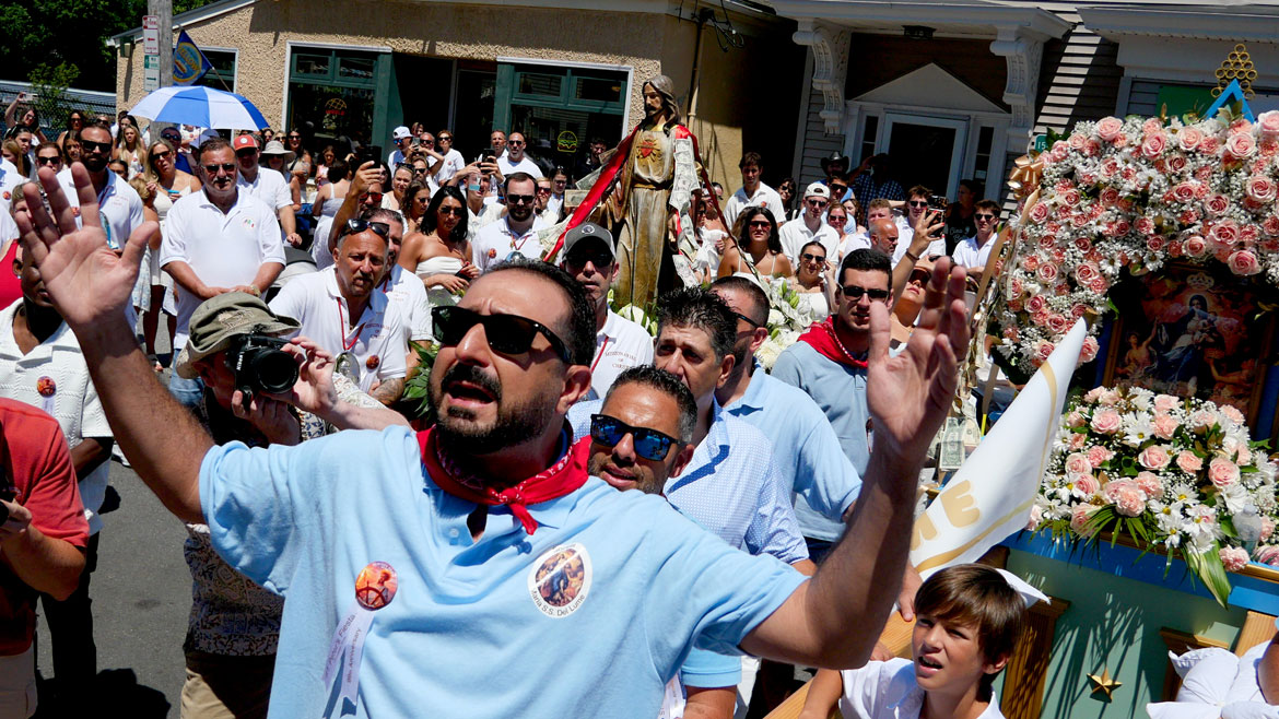 Yelling blessings during the St. Peter's Fiesta Sunday Procession, Gloucester, June 28, 2026. (©Greg Cook photo)