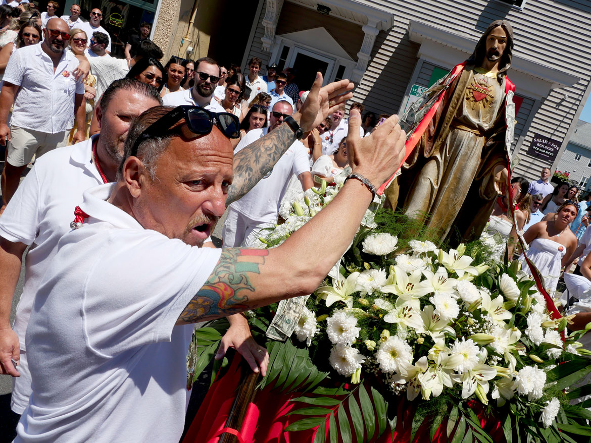 Yelling blessings during the St. Peter's Fiesta Sunday Procession, Gloucester, June 28, 2026. (©Greg Cook photo)