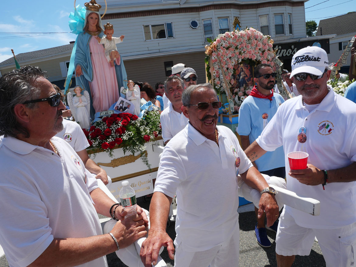 Rosario Maletti shouts blessings during the St. Peter's Fiesta Sunday Procession, Gloucester, June 28, 2026. (©Greg Cook photo)