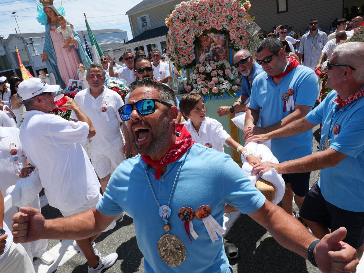 Enzo DiMaio shouts blessings with the Madonna del Lume during St. Peter’s Fiesta Sunday Procession at Our Lady of Good Voyage Church, Gloucester, June 28, 2026. (©Greg Cook photo)