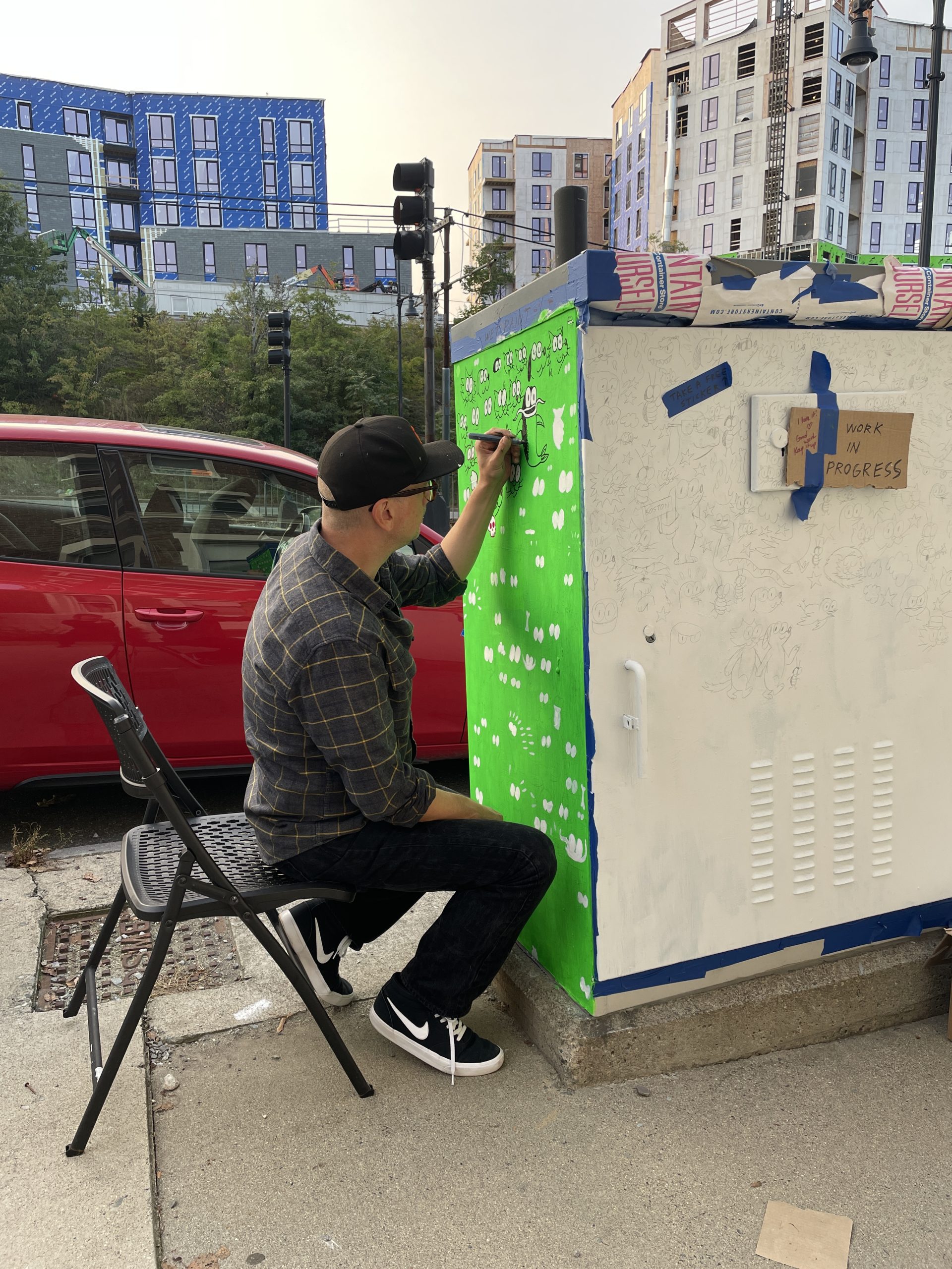 Ansis Puriņš creating electrical box mural at 1504 Comm Ave., Boston, 2023.