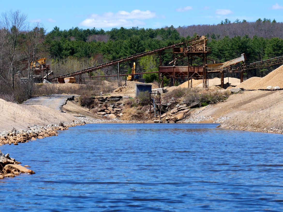 R.J. McDonald Inc. “washed stone” and sand plant just upstream of the Wheelwright Dam. State staff have worked with the company to maintain its access to draw water from the river. April 26, 2026. (©Greg Cook photo)